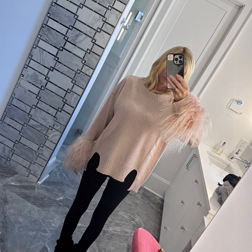 Sweater with furry sleeves
